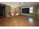 Spacious living room featuring hardwood floors, staircase, and ample natural light from a window at 1705 Witt Rd, Lebanon, IN 46052