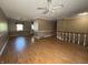 Spacious living room featuring hardwood floors, ample natural light, and a ceiling fan at 1705 Witt Rd, Lebanon, IN 46052