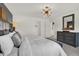 Relaxing bedroom includes a king bed, stylish dresser, and en-suite bath at 2138 Foothill Dr, Greenfield, IN 46140