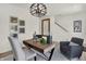 Inviting study featuring stylish decor, a modern chandelier, and ample space for a comfortable and productive workspace at 2138 Foothill Dr, Greenfield, IN 46140