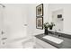 Pristine bathroom with a combined bathtub and shower, complemented by stylish decor at 2215 Boxwood Dr, Greenfield, IN 46140