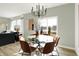 Inviting dining area with modern chandelier and a view of the outdoors at 2215 Boxwood Dr, Greenfield, IN 46140