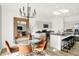 Elegant dining area adjacent to a kitchen with an island, perfect for gatherings at 2215 Boxwood Dr, Greenfield, IN 46140