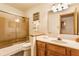 Bathroom featuring a glass-enclosed shower, oak vanity, and well-lit mirror at 2236 Calaveras Way, Indianapolis, IN 46240