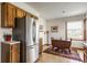 Well-lit kitchen featuring a stainless steel refrigerator and wooden cabinetry at 2236 Calaveras Way, Indianapolis, IN 46240