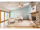 Bright living room with fireplace, ceiling fan, and sliding doors to the exterior at 2236 Calaveras Way, Indianapolis, IN 46240