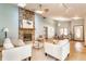 Spacious living room with a stone fireplace, skylights, and an open layout leading to the dining area at 2236 Calaveras Way, Indianapolis, IN 46240