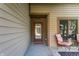 Welcoming front porch with a decorative glass door and comfortable seating, ideal for enjoying the outdoors at 2236 Calaveras Way, Indianapolis, IN 46240