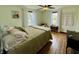 Cozy bedroom featuring hardwood floors, two windows, and neutral décor at 2405 Sycamore St, Columbus, IN 47201