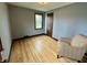 Empty Bedroom featuring hardwood floors and light blue walls at 2405 Sycamore St, Columbus, IN 47201