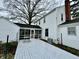 Rear exterior of the house with a spacious deck and access to the screened porch at 2405 Sycamore St, Columbus, IN 47201