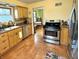 Traditional kitchen with stainless steel appliances, light wood cabinets and a tile floor at 2405 Sycamore St, Columbus, IN 47201