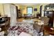 Spacious living room with hardwood floors, comfortable furniture, area rug, and abundant natural light, offering a relaxing space at 2405 Sycamore St, Columbus, IN 47201