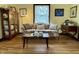 Bright living room features hardwood floors, a floral couch, and decorative accents, creating a cozy and inviting atmosphere at 2405 Sycamore St, Columbus, IN 47201