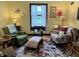 Inviting living room with floral decor, natural light from a window, area rug, and comfortable seating, enhancing the charm at 2405 Sycamore St, Columbus, IN 47201