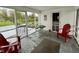 Relaxing screened-in porch with outdoor seating and a view of the garden at 2405 Sycamore St, Columbus, IN 47201