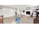 Finished basement area with fireplace and built-in shelves providing a cozy living space at 2512 E 57Th St, Indianapolis, IN 46220