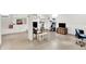Spacious basement featuring finished walls, epoxy flooring, a fireplace, and a seating area at 2512 E 57Th St, Indianapolis, IN 46220