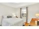 Well-lit bedroom with hardwood floors, neutral walls, and double bed at 2512 E 57Th St, Indianapolis, IN 46220