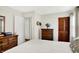 Comfortable bedroom featuring hardwood floors, neutral walls, and a closet with paneled doors at 2512 E 57Th St, Indianapolis, IN 46220
