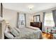 Cozy bedroom with hardwood floors, natural light, and tasteful decor at 2512 E 57Th St, Indianapolis, IN 46220