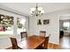Cozy dining room with hardwood floors, a chandelier, and views of the neighborhood at 2512 E 57Th St, Indianapolis, IN 46220