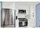 Contemporary kitchen with stainless steel appliances, white cabinets, and modern countertops at 2512 E 57Th St, Indianapolis, IN 46220