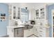Bright kitchen featuring white cabinets, stainless steel appliances, and ample counter space at 2512 E 57Th St, Indianapolis, IN 46220