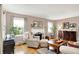 Comfortable living room features hardwood floors, fireplace, and plenty of natural light at 2512 E 57Th St, Indianapolis, IN 46220