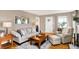 Relaxing living room featuring hardwood floors, neutral walls, and comfortable seating at 2512 E 57Th St, Indianapolis, IN 46220