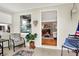Bright sun room with neutral tiling, large windows, ceiling fan and access to living room at 2512 E 57Th St, Indianapolis, IN 46220