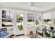 Bright and airy sun room featuring tiled floors, large windows, and access to outdoors at 2512 E 57Th St, Indianapolis, IN 46220