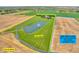 Aerial view of a 13.31-acre property with a pond and fountain, including the adjacent 10.01-acre lot next door at 2575 W 100 S, Franklin, IN 46131