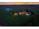 Aerial view showcasing the estate, meticulously maintained lawn, guest house, and sunset at 2575 W 100 S, Franklin, IN 46131