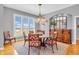 Elegant dining room featuring a round table, decorative chandelier, and window with shutters for a bright, inviting space at 2575 W 100 S, Franklin, IN 46131