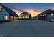 Long driveway leading to detached garages on an expansive property with sunset at 2575 W 100 S, Franklin, IN 46131