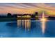 Stunning exterior view of a luxurious home reflecting beautifully in the tranquil pond at sunset at 2575 W 100 S, Franklin, IN 46131