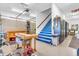 Spacious garage with work tables, cabinets, and stairwell access at 2575 W 100 S, Franklin, IN 46131