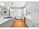 Spacious kitchen with white cabinets, white countertops, stainless steel appliances, and an island with a gas stovetop at 2575 W 100 S, Franklin, IN 46131