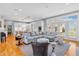 Open floor plan with a spacious living room with a large sectional couch and a view into the kitchen at 2575 W 100 S, Franklin, IN 46131