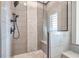 Glass-enclosed shower with modern fixtures and light gray tiling, complete with a built-in shower bench at 2575 W 100 S, Franklin, IN 46131