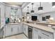 Elegant wet bar featuring granite countertops, custom cabinetry, and a wine refrigerator at 2575 W 100 S, Franklin, IN 46131