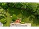 Overhead view highlighting the backyard with a fire pit, spacious deck, and mature trees at 269 Manchester Ct, Noblesville, IN 46060