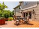 Back deck with outdoor seating area and views of the brick and siding exterior of the home at 269 Manchester Ct, Noblesville, IN 46060