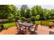 Inviting deck with outdoor dining furniture and a landscaped backyard, perfect for entertaining guests at 269 Manchester Ct, Noblesville, IN 46060