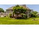 Beautiful backyard with a lush lawn, firepit, mature trees, and a wooden deck at 269 Manchester Ct, Noblesville, IN 46060