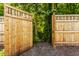 Private backyard featuring a gated entrance to a wooded area at 269 Manchester Ct, Noblesville, IN 46060