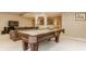A finished basement with a pool table, seating area, and bar area at 269 Manchester Ct, Noblesville, IN 46060