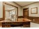 Spacious basement office with a built-in desk and trim, plus an open floorplan to a seating area at 269 Manchester Ct, Noblesville, IN 46060