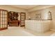 The basement area features a bar area with a unique glass block design and built-in shelving at 269 Manchester Ct, Noblesville, IN 46060